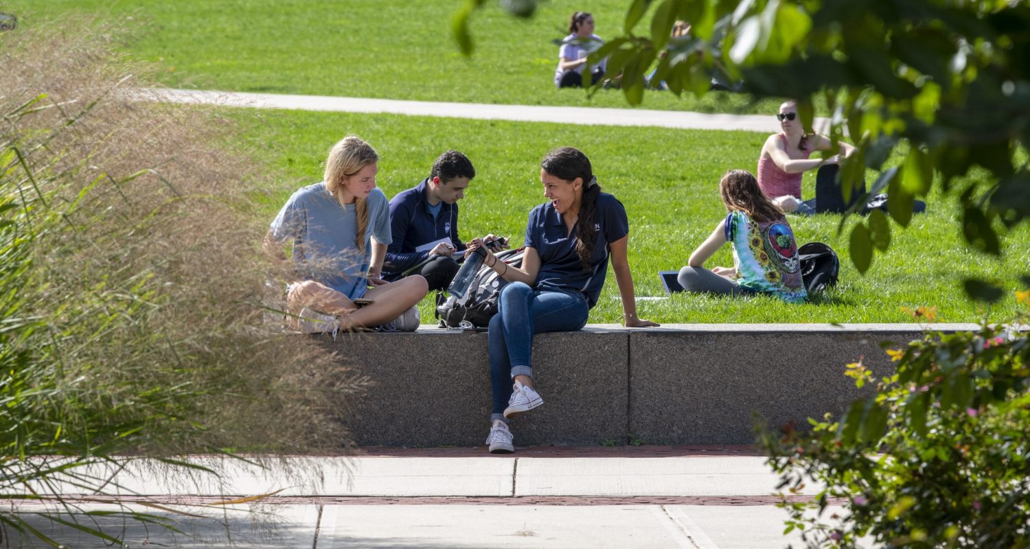Students socializing and talking at the Student Union Mall on Oct. 10, 2018. (Sean Flynn/UConn Photo)